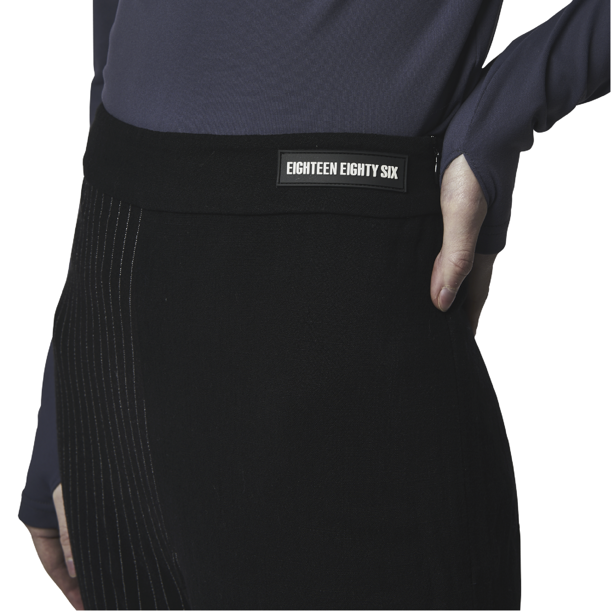 Classic fit flared cut pants in black fabric featuring Eighteen Eighty-Six logo patch sewn at waist. Lines details at legs. High waist.