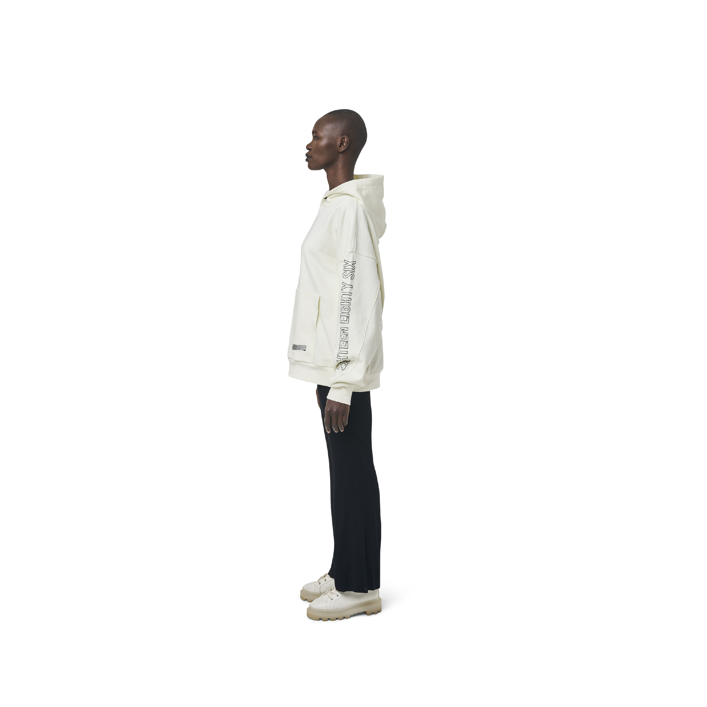 Long sleeves oversize cut hoodie in washed off white color fabric featuring 1886 print at sleeves. 1886 logo embroidered at kangaroo pocket. A button on the hood. Rib knit at cuffs and hem.