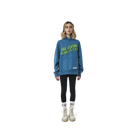Long sleeves oversize cut hoodie in washed sapphire blue color fabric featuring  ' The Flying Monkeys Club ' logo print at front and at back. 1886 logo embroidered at kangaroo pocket. Rib knit at cuffs and hem.
