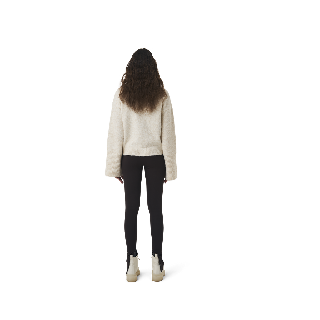 Long sleeves highneck cut wool sweater in beige color fabric featuring 1886 logo embroidered at bottom front. Loose at cuffs and hem.