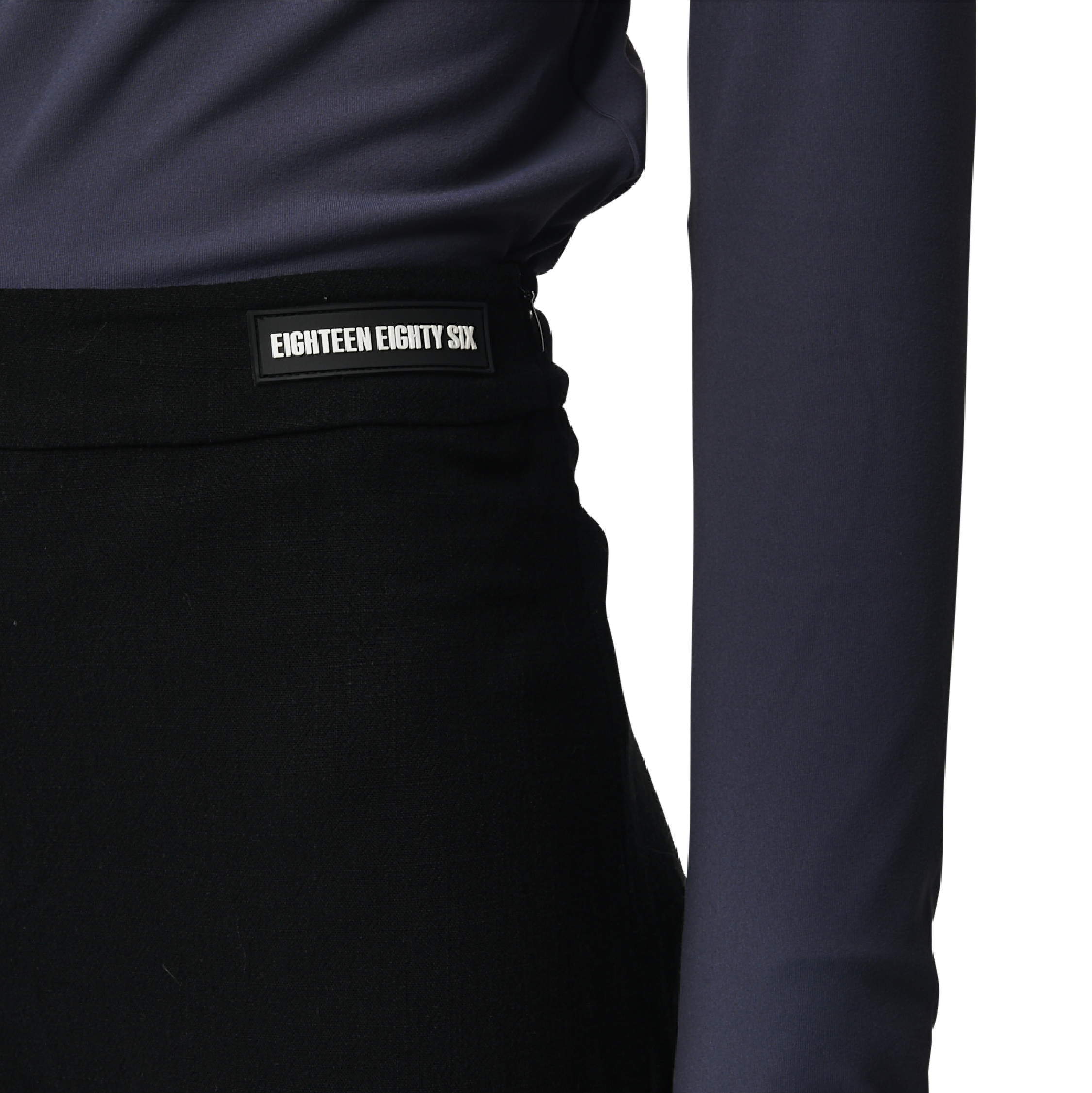 Classic fit charleston cut pants in black fabric featuring Eighteen Eighty-Six logo patch sewn at waist. High waist.