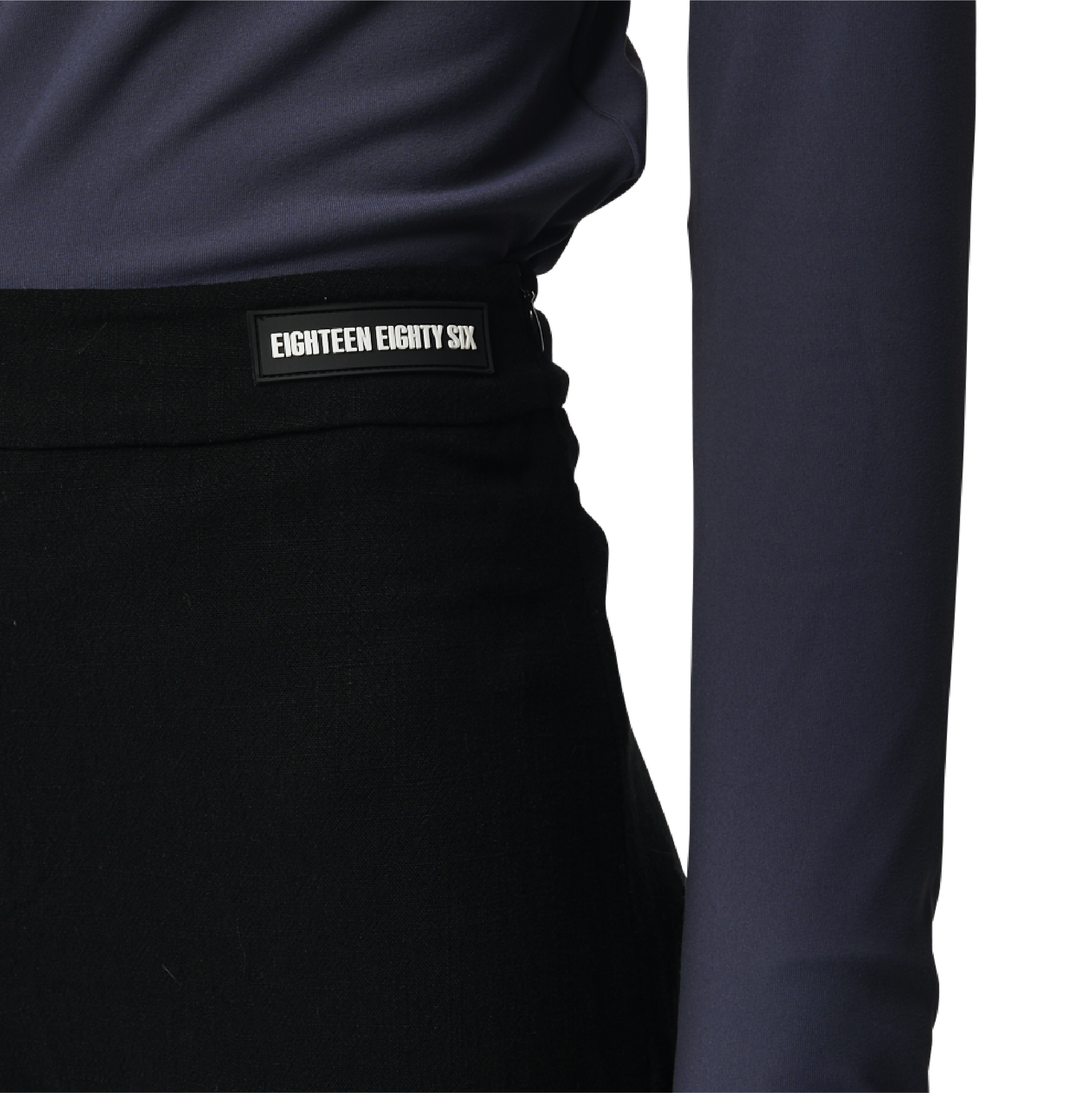Classic fit charleston cut pants in black fabric featuring Eighteen Eighty-Six logo patch sewn at waist. High waist.