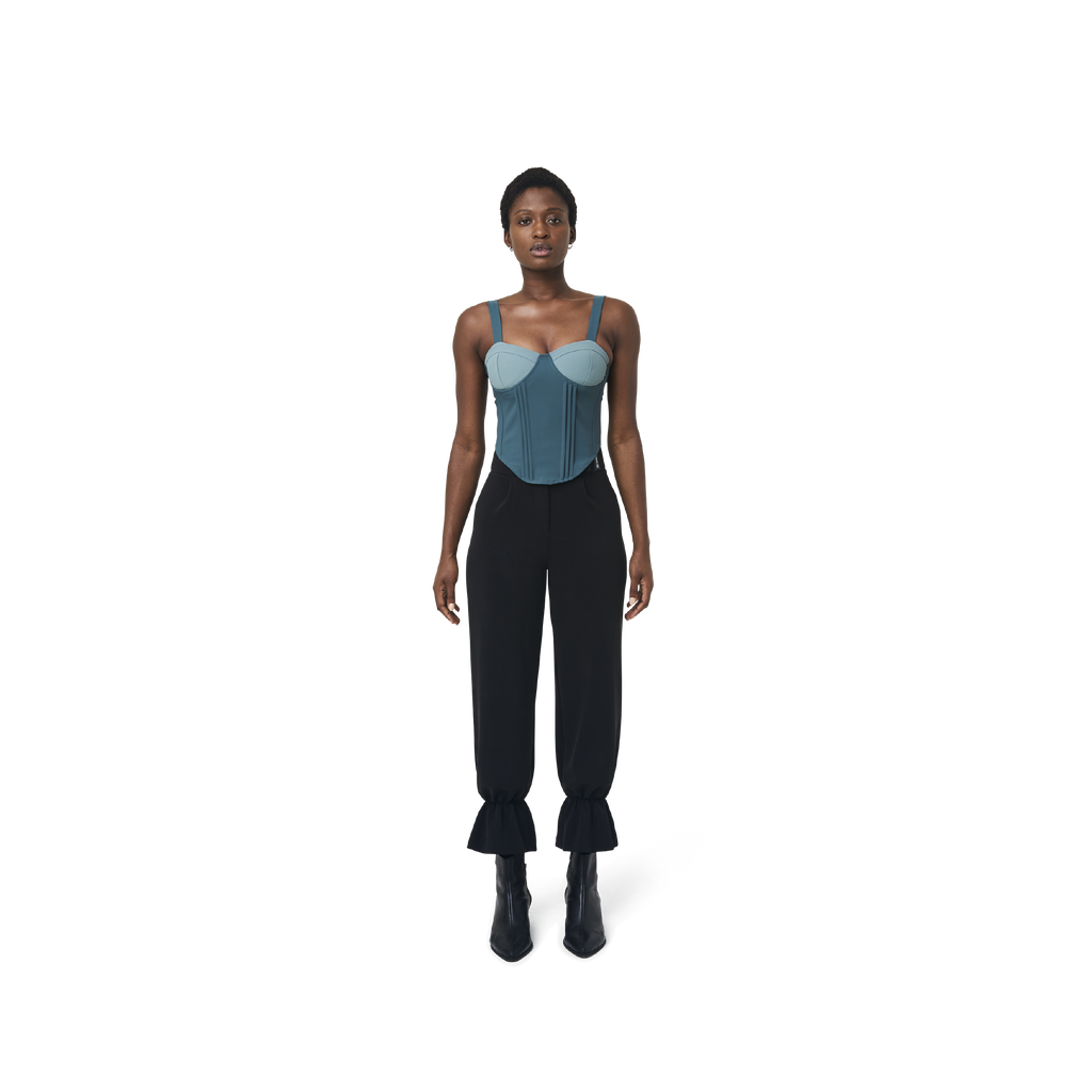 Cropped corset top in mix blue fabric color featuring lines details at front. logo patch sewn at Scoop neck. Full zipper at back.