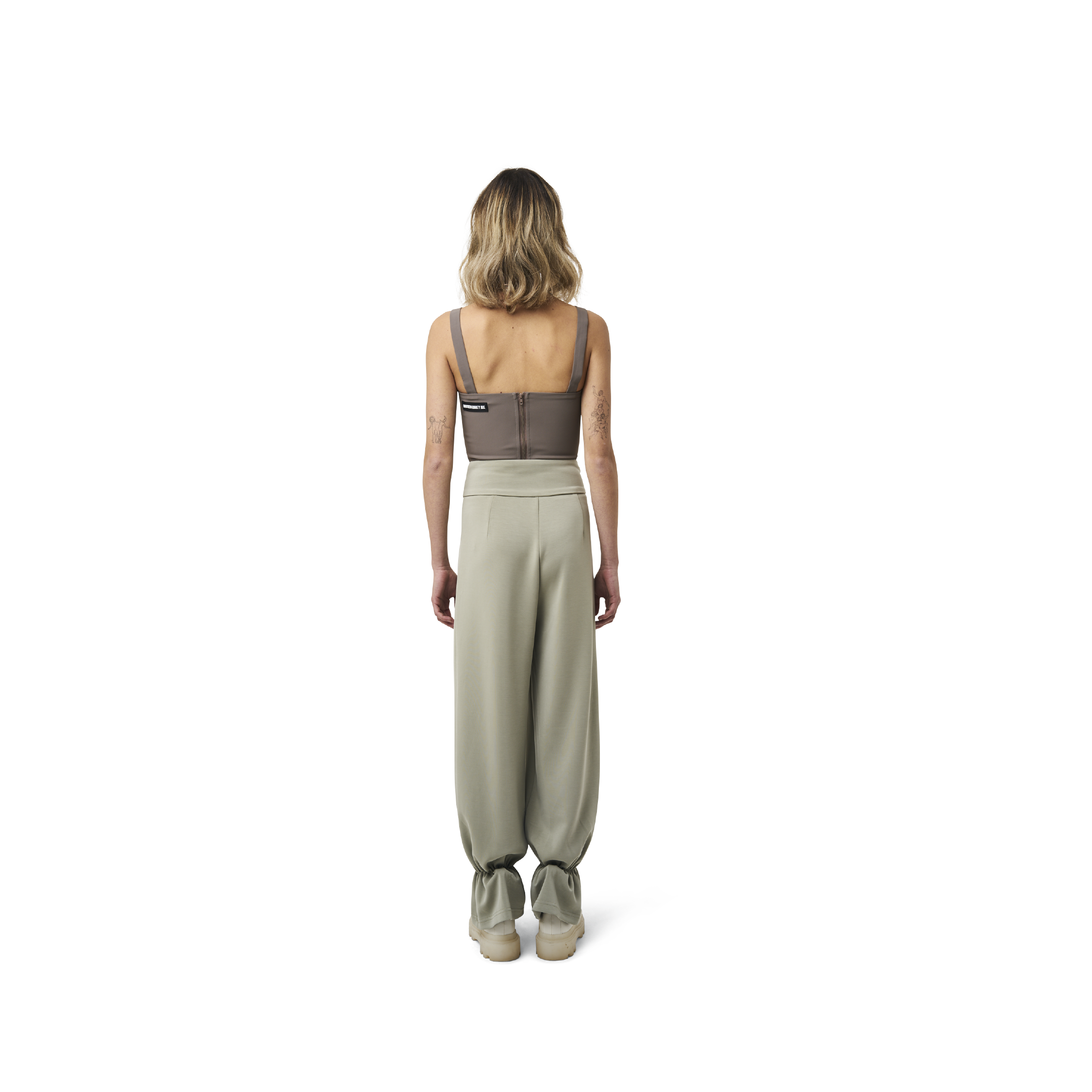 Cropped corset top in mix green fabric color featuring lines details at front. logo patch sewn at Scoop neck. Full zipper at back.