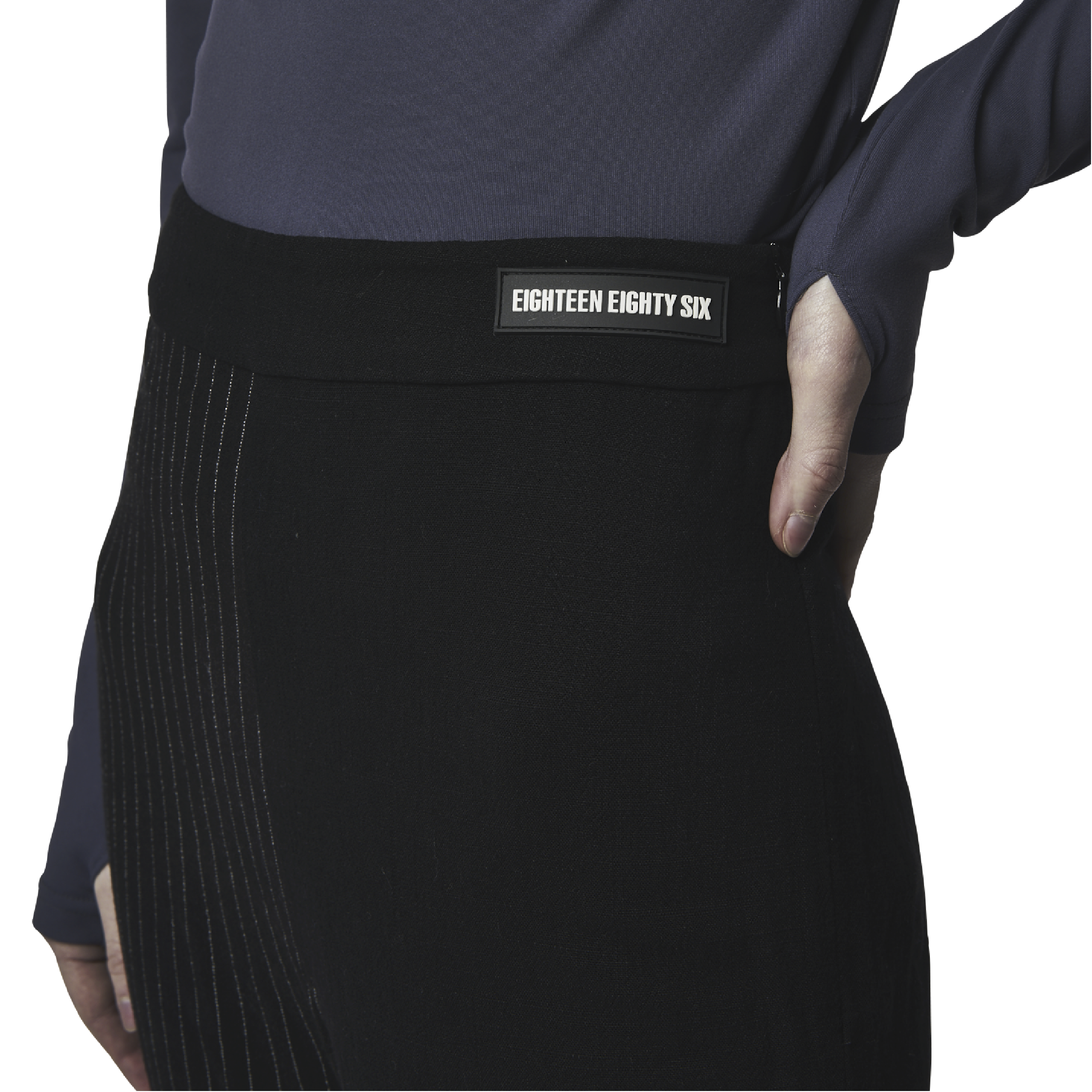 Classic fit flared cut pants in black fabric featuring Eighteen Eighty-Six logo patch sewn at waist. Lines details at legs. High waist.