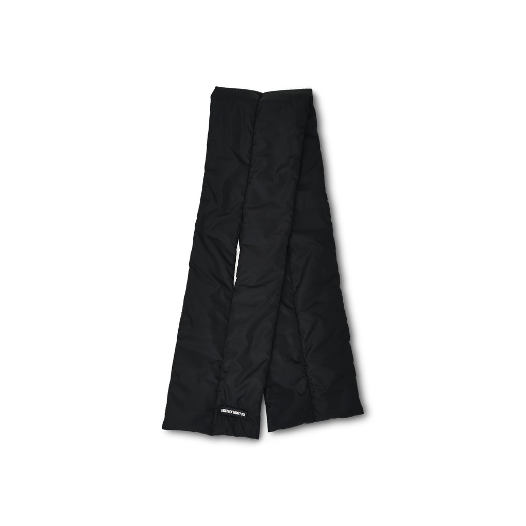 Rectangular down puffer scarf in black featuring Eighteen Eighty-Six logo patch sewn at bottom